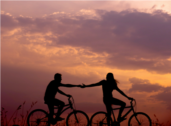 couple13 a couple in silhouette riding bikes
