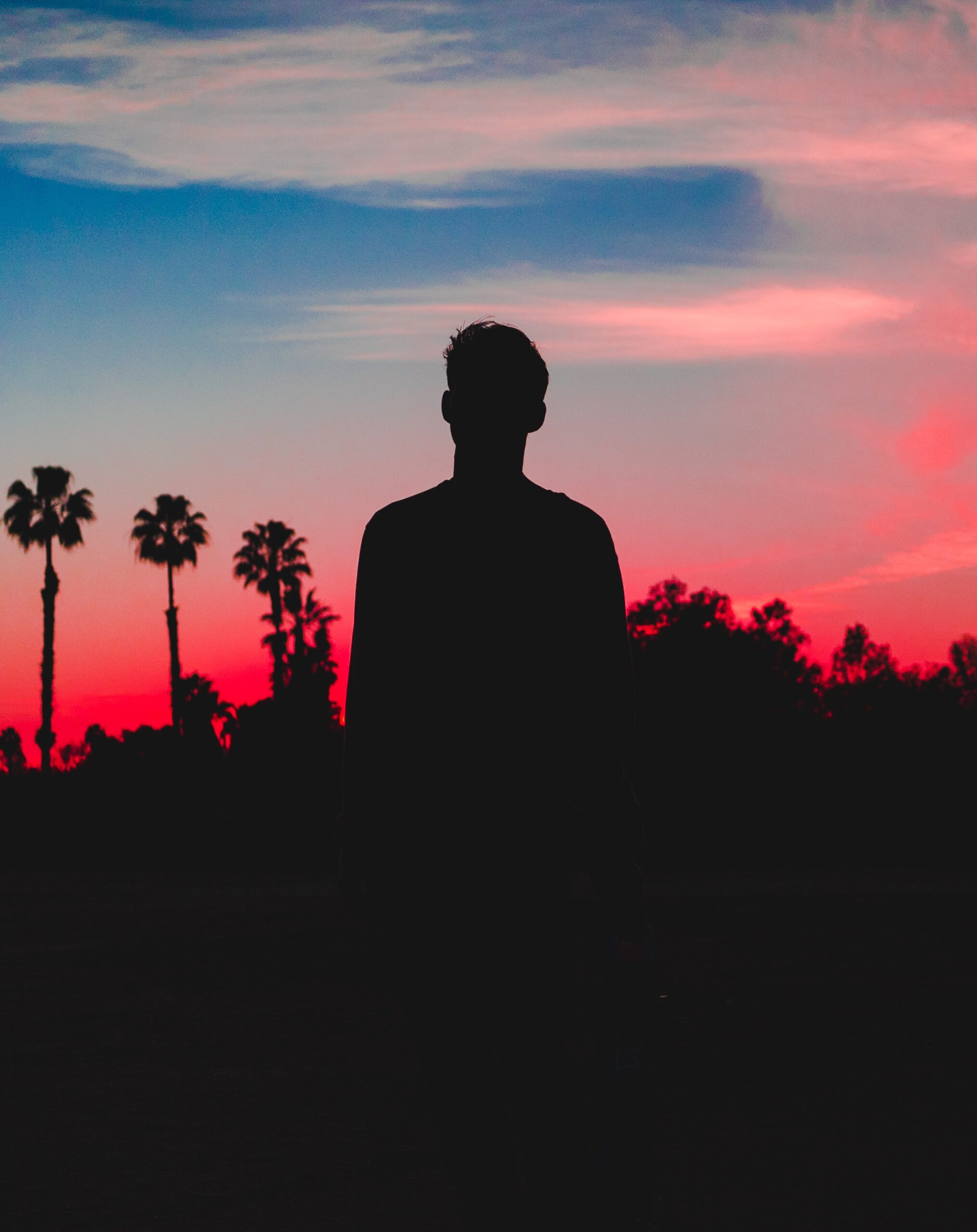 a man silhouetted at sunset