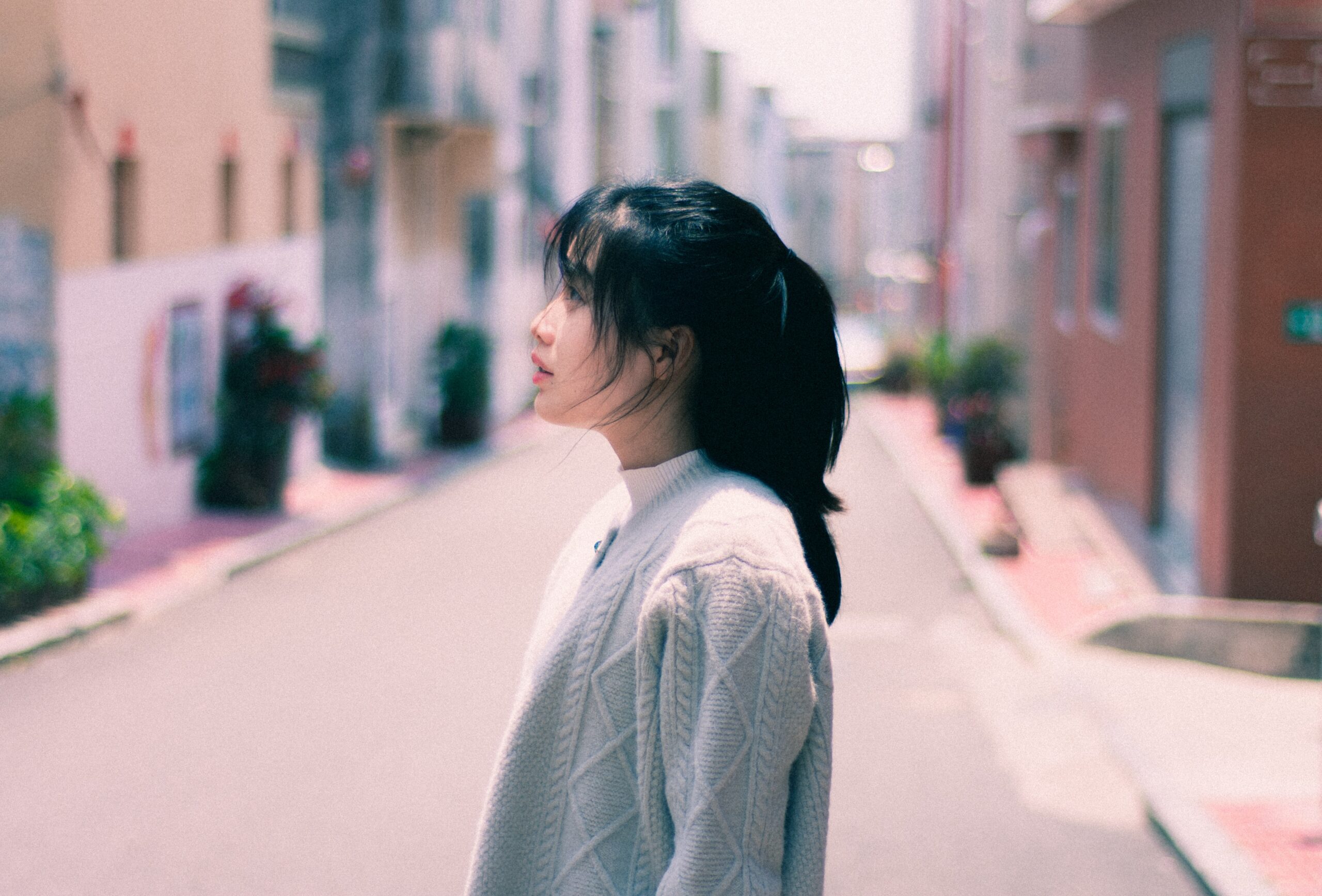 a woman facing to the side